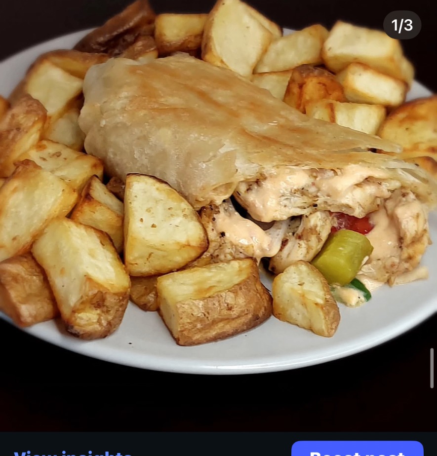 Crispy saj bread wrap served with roasted potatoes