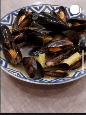 Mussels steamed in white wine in a patterned bowl