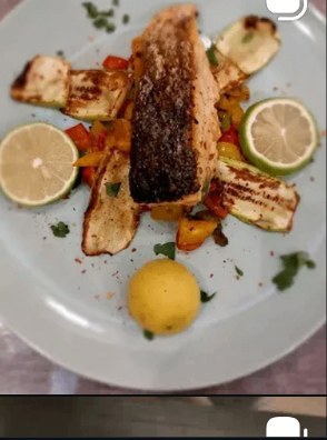 Pan-seared salmon with sautéed vegetables and lime