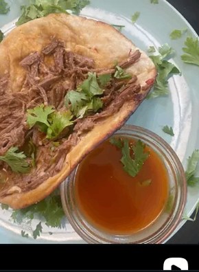 Braised beef taco served with rich consommé