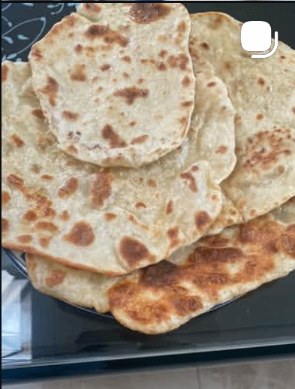 Stack of fresh homemade naan and pita flatbreads