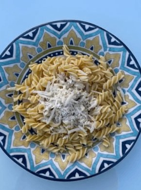 Fusilli with parmesan on a Moroccan-tiled plate