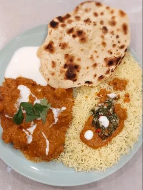 Butter chicken with basmati rice and freshly baked flatbread