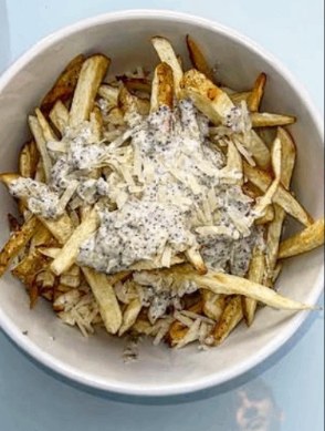 Crispy fries piled high with parmesan and ranch